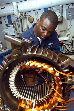 Engineer rewinding an electric motor